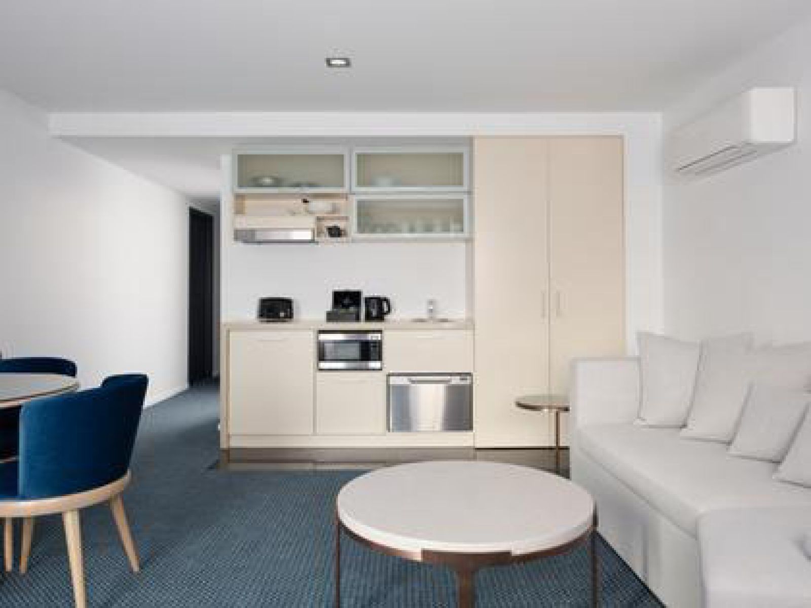 The living area of a king single room at the RACV Hobart Hotel.