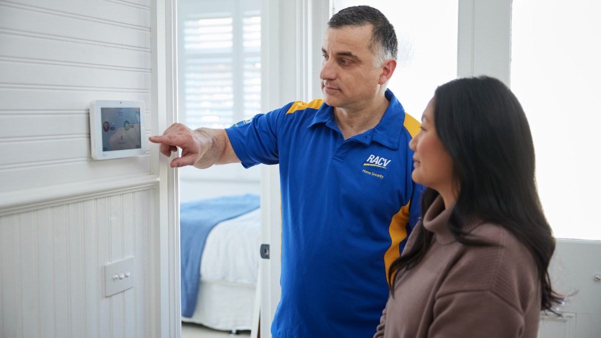 RACV tradie showing homeowner alarm system