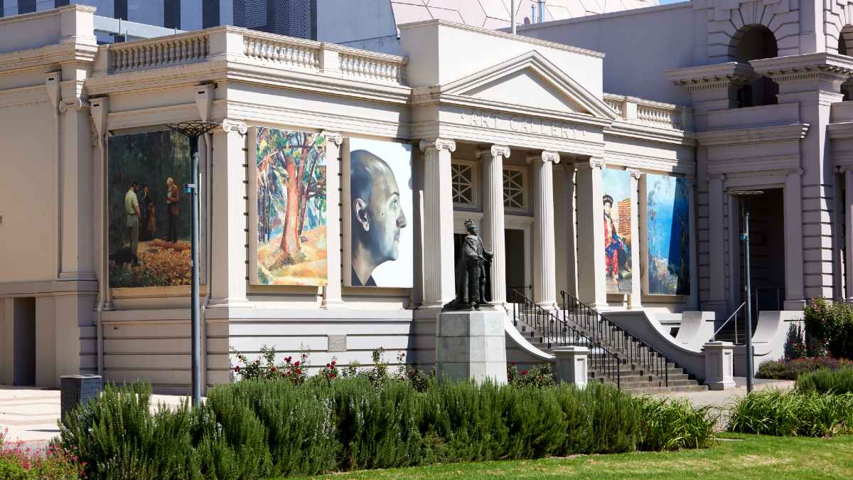 white art gallery with supersized paintings on outside