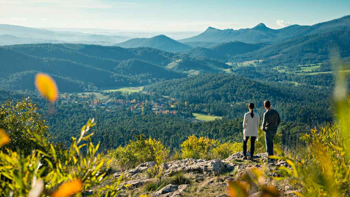 woman and man standing at lookout over Marysville