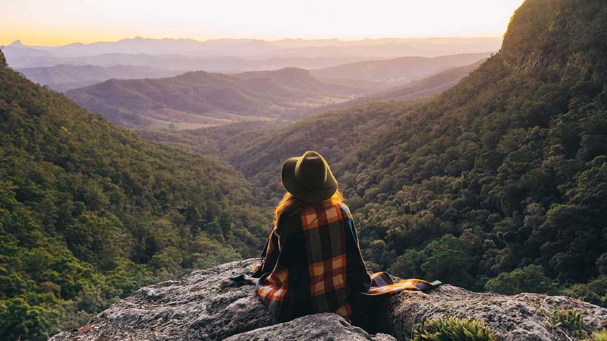 Girl looking out at view of the mountains