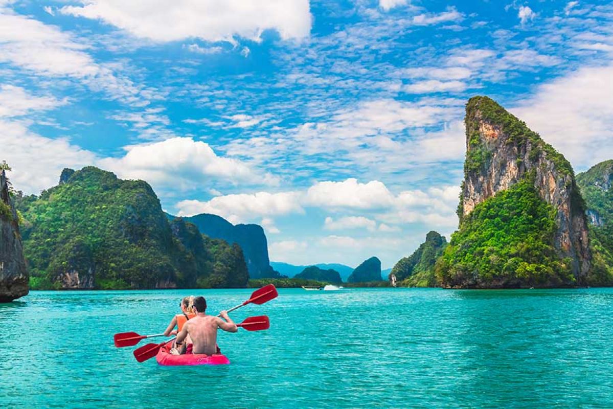 couple kayaking through clear waters in Phuket