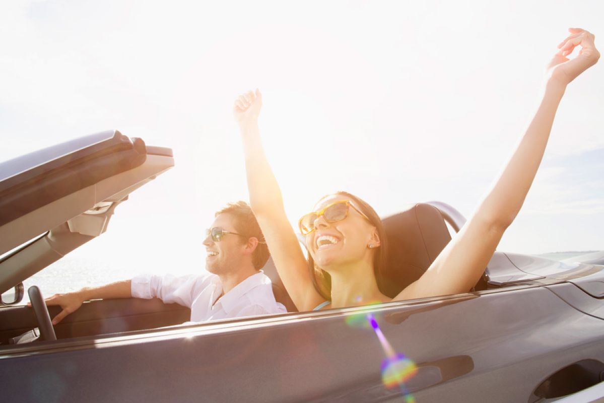 Couple happy in sports car
