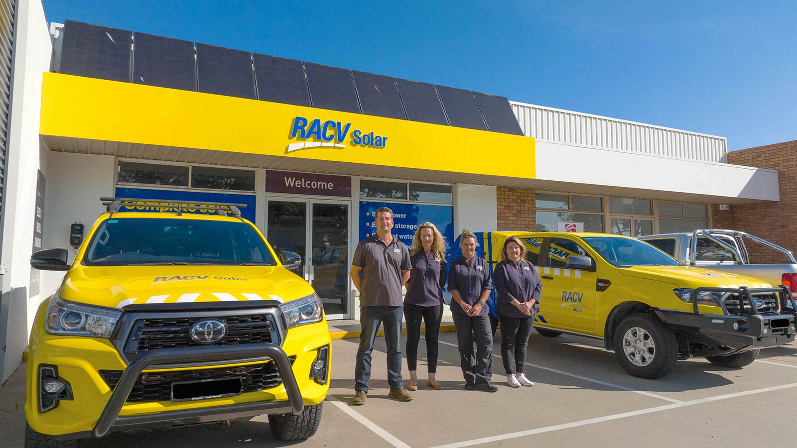 Four solar experts standing in front of RACV Solar Gippsland.