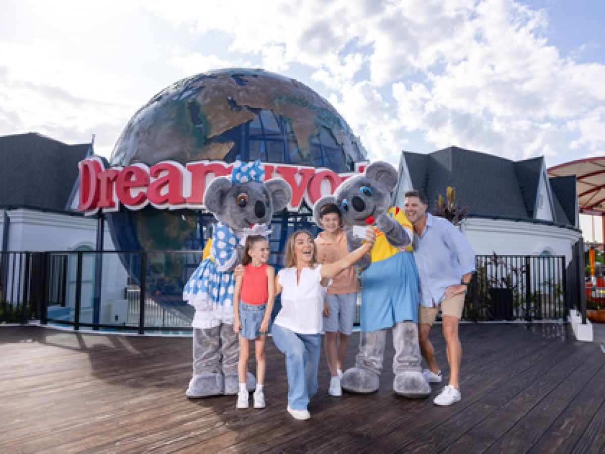 Family taking a selfie at Dreamworld with koala characters