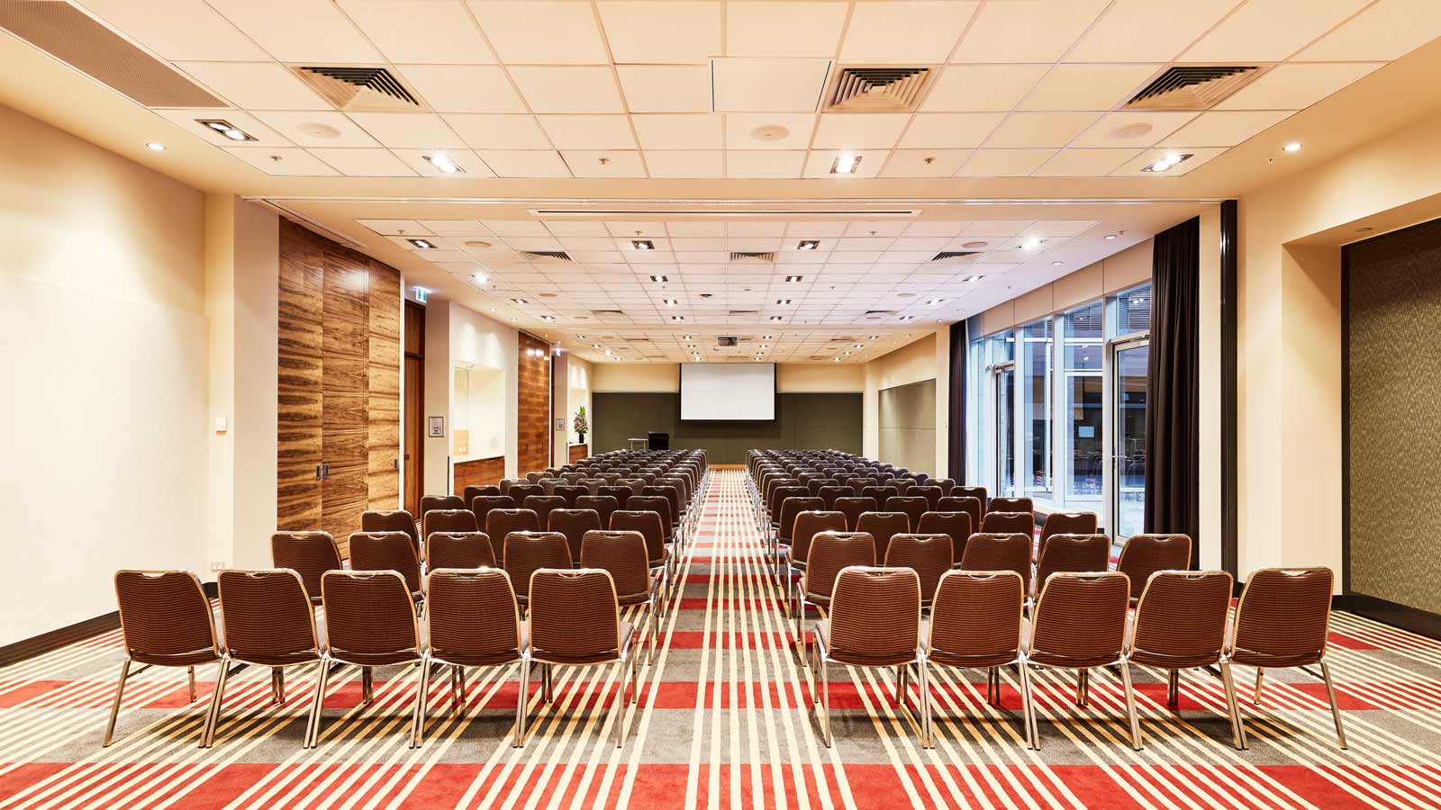 Bayside conference room with seating arranged theatre style.