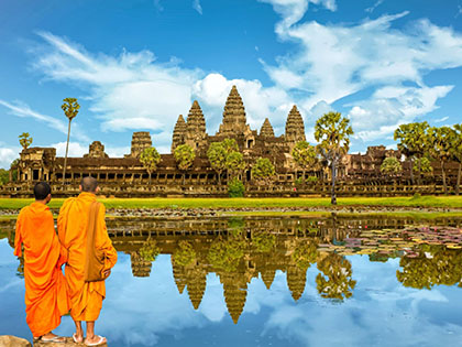 Image of Angkor Wat Temple in Thailand, reflected in still water.