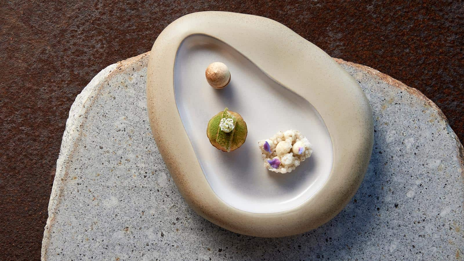 White ceramic dish with three small gourmet food items at RACV's Cape Schanck resort.