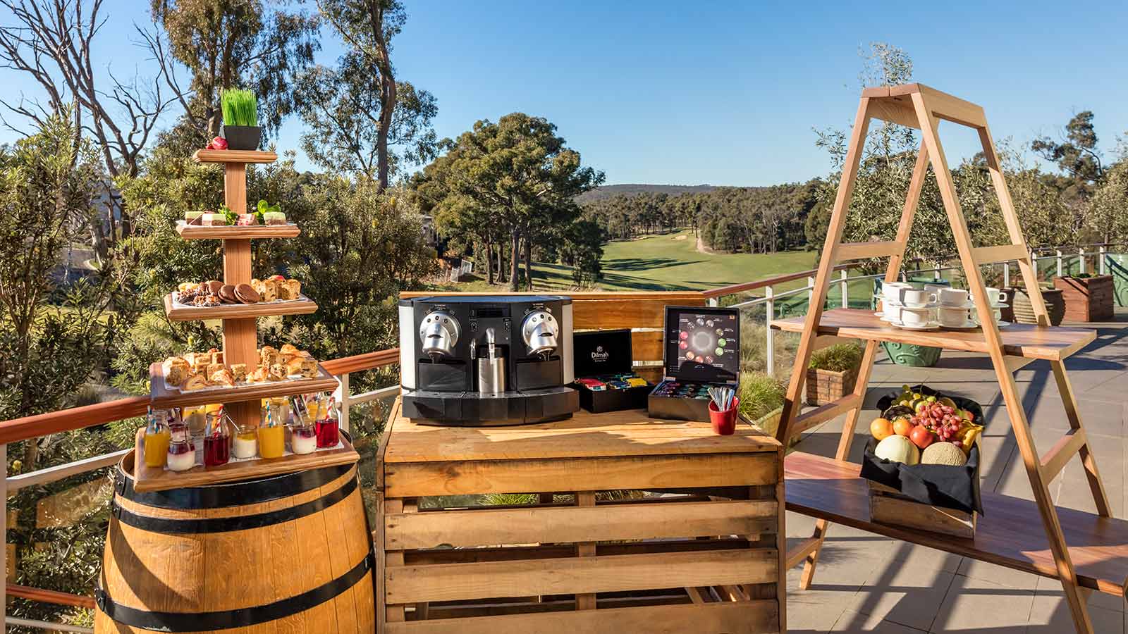 Coffee machine and tiers of food set up for high tea at RACV Goldfields Resort. 