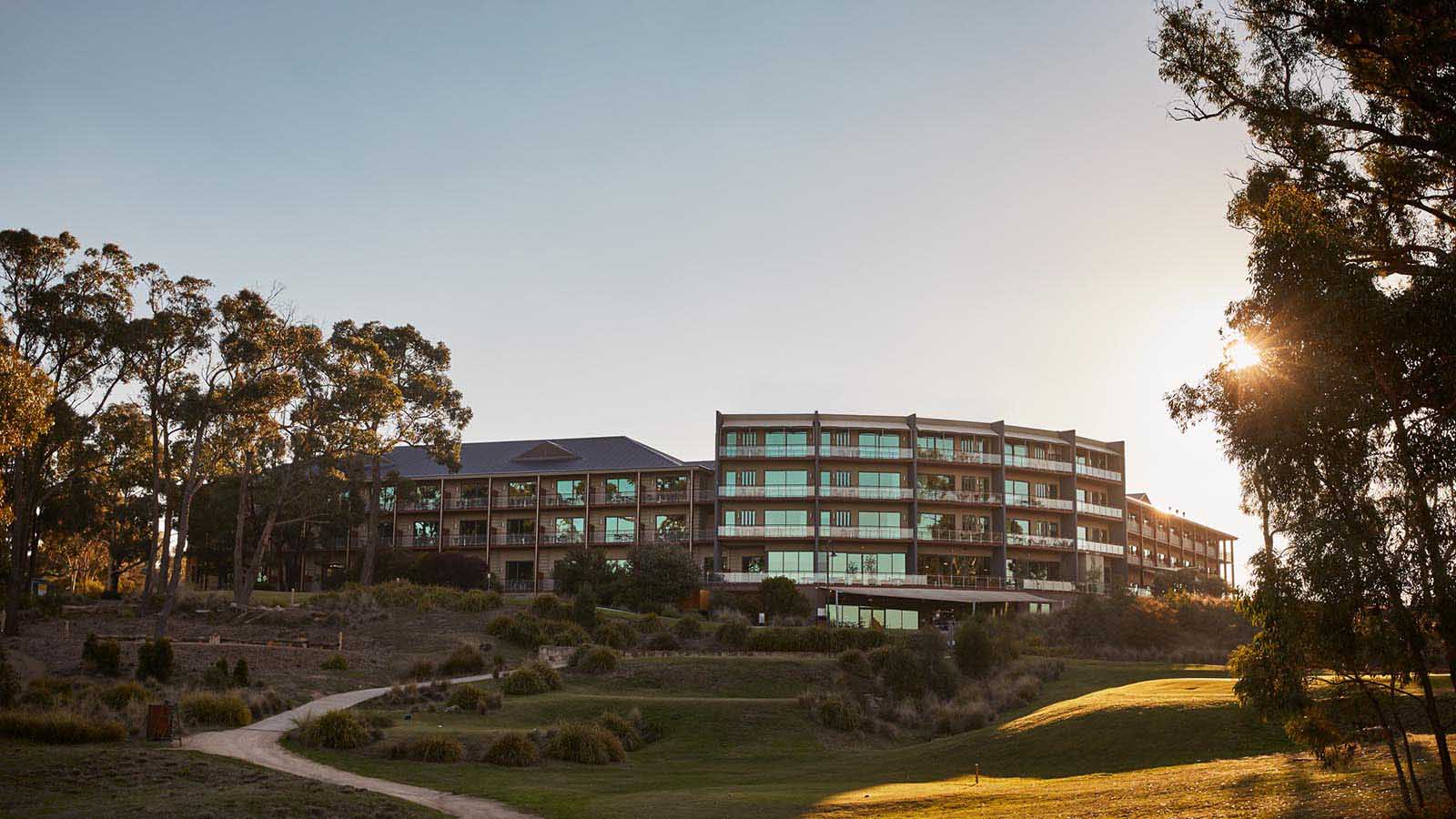 Exterior view of RACV Goldfields resort at golden hour.