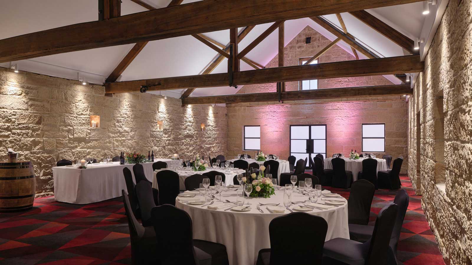 The Stables set up for a wedding dinner service. 