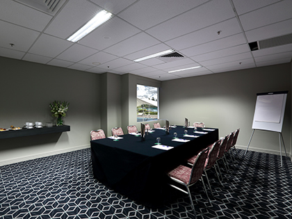 Boronia room at RACV Royal Pines Resort, set up boardroom style.