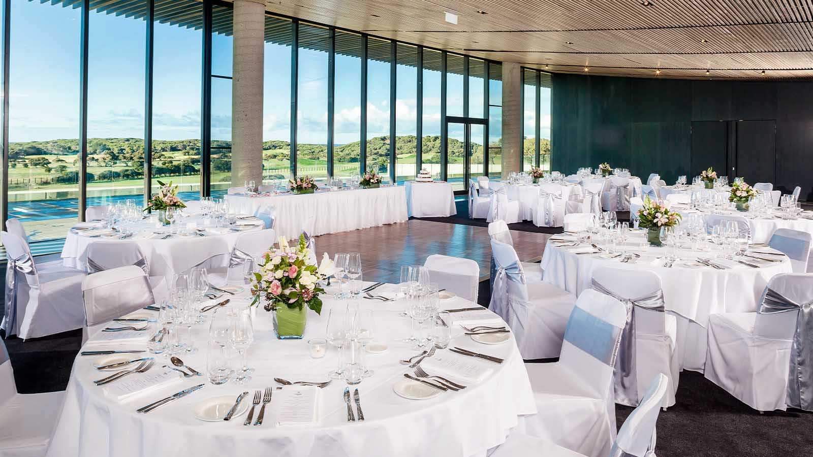 Table settings for a wedding reception at Torquay Resort, set up banquet style.