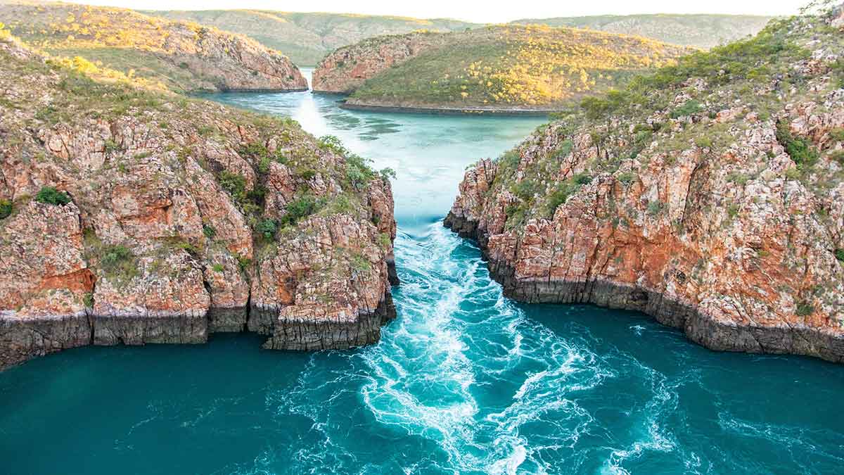 Scenic photo of a river going between two mountains