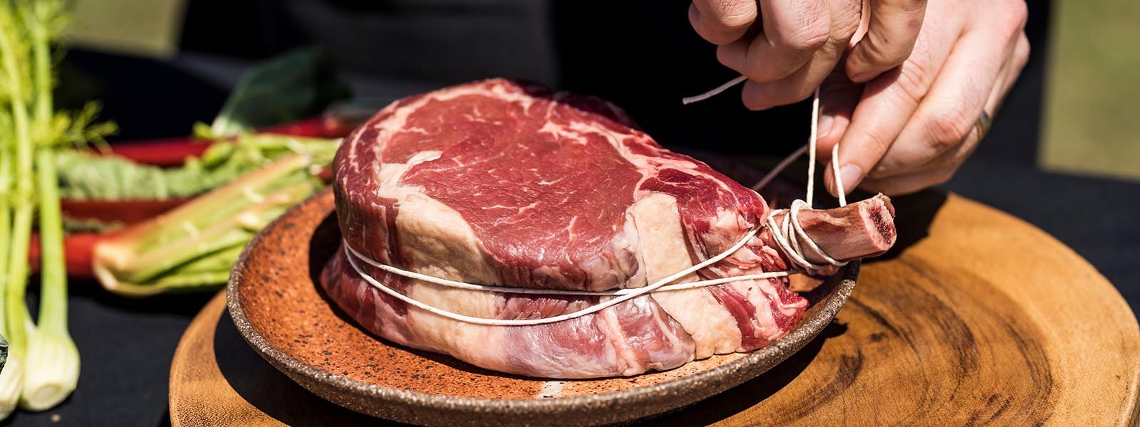 steak being tied up with string