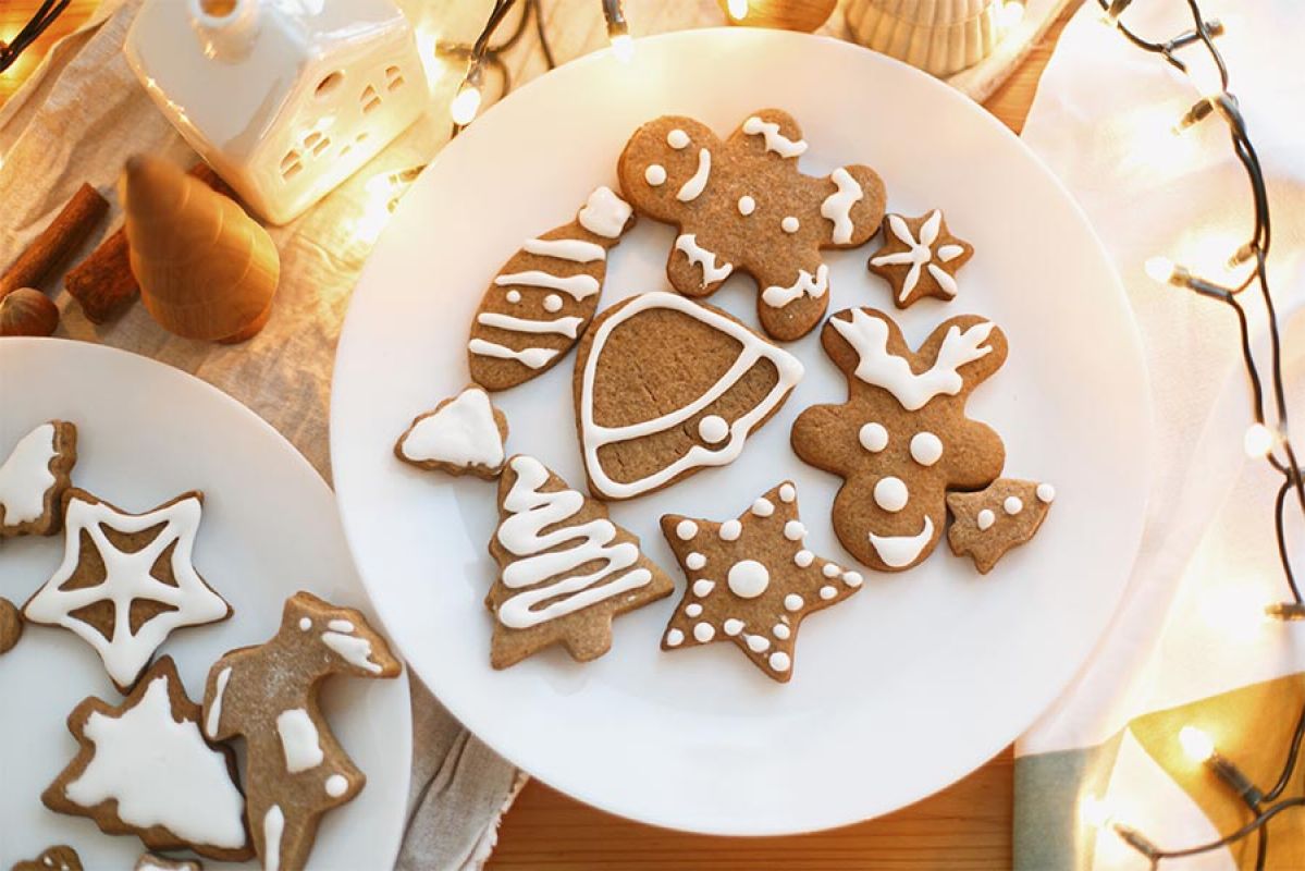 Gingerbread cookies decorated on white serving plate