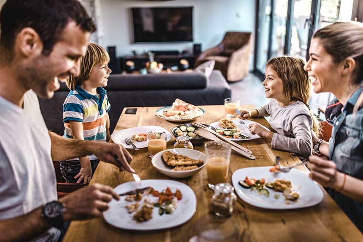 family eating together at dinner table