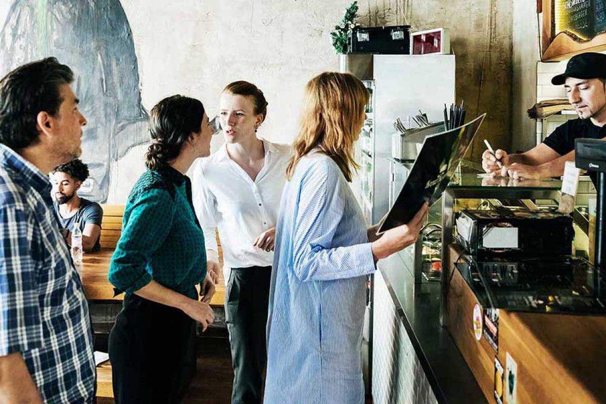 customers standing in line ordering a coffee