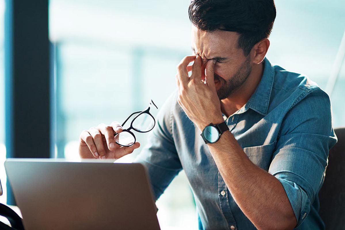 Man rubbing his eyes