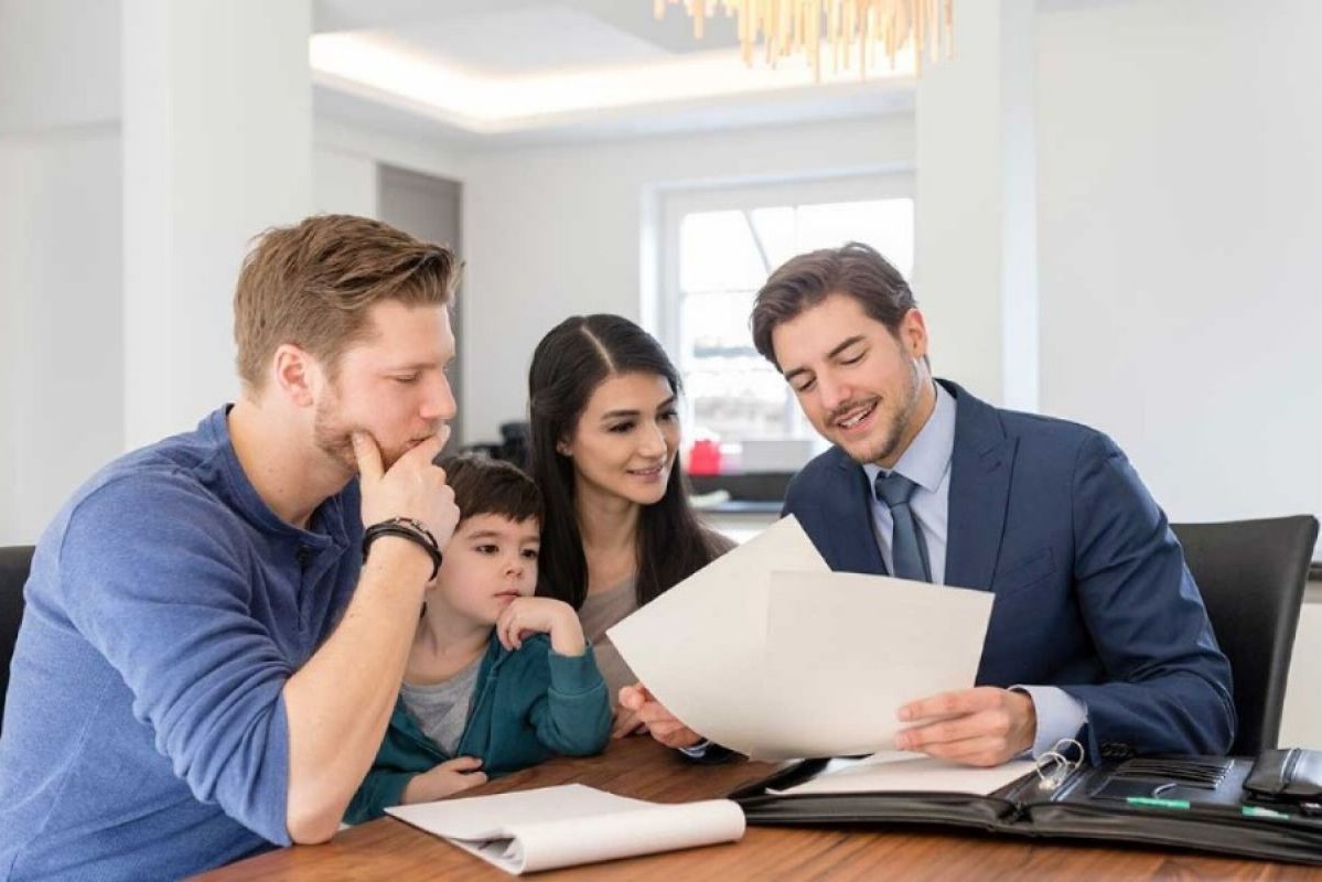 family signing a contract with a conveyancer