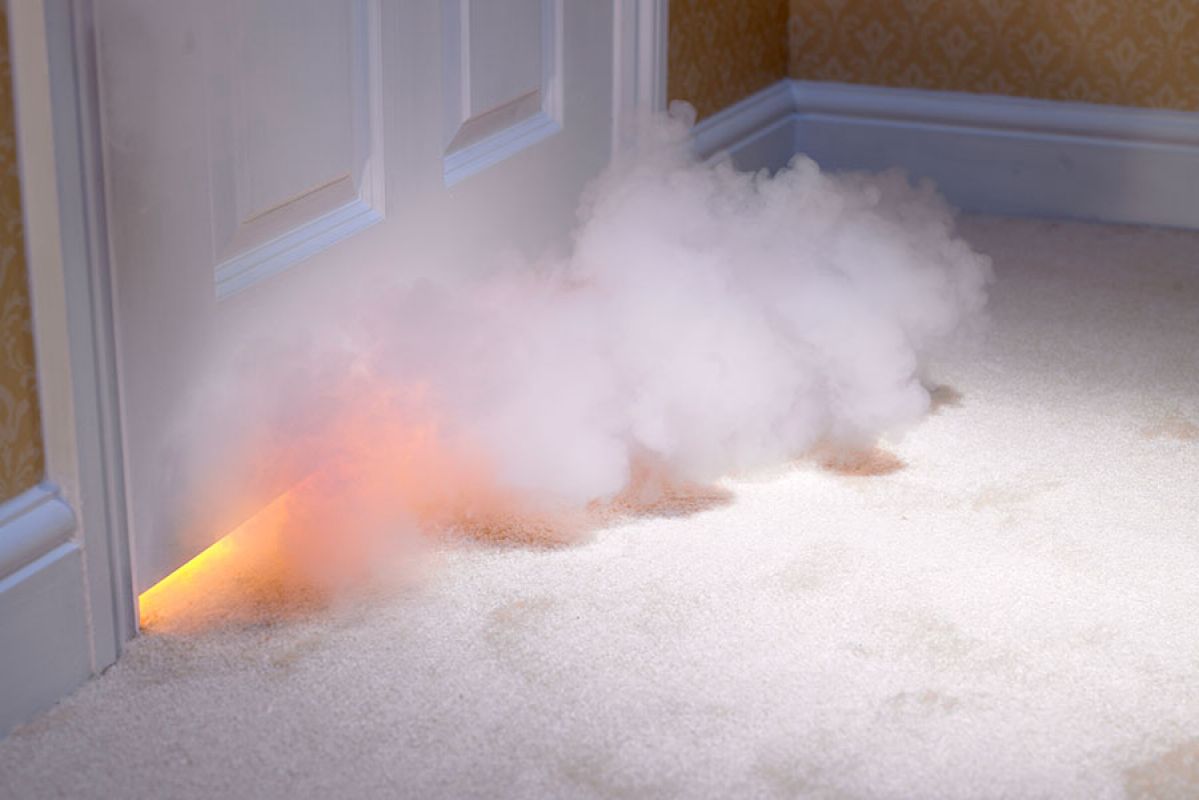 Fire and smoke pouring out of bedroom door