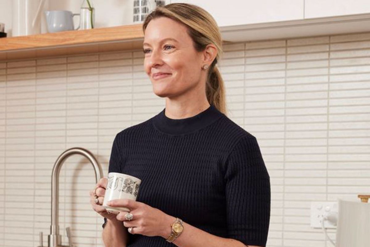 Woman in renovated kitchen