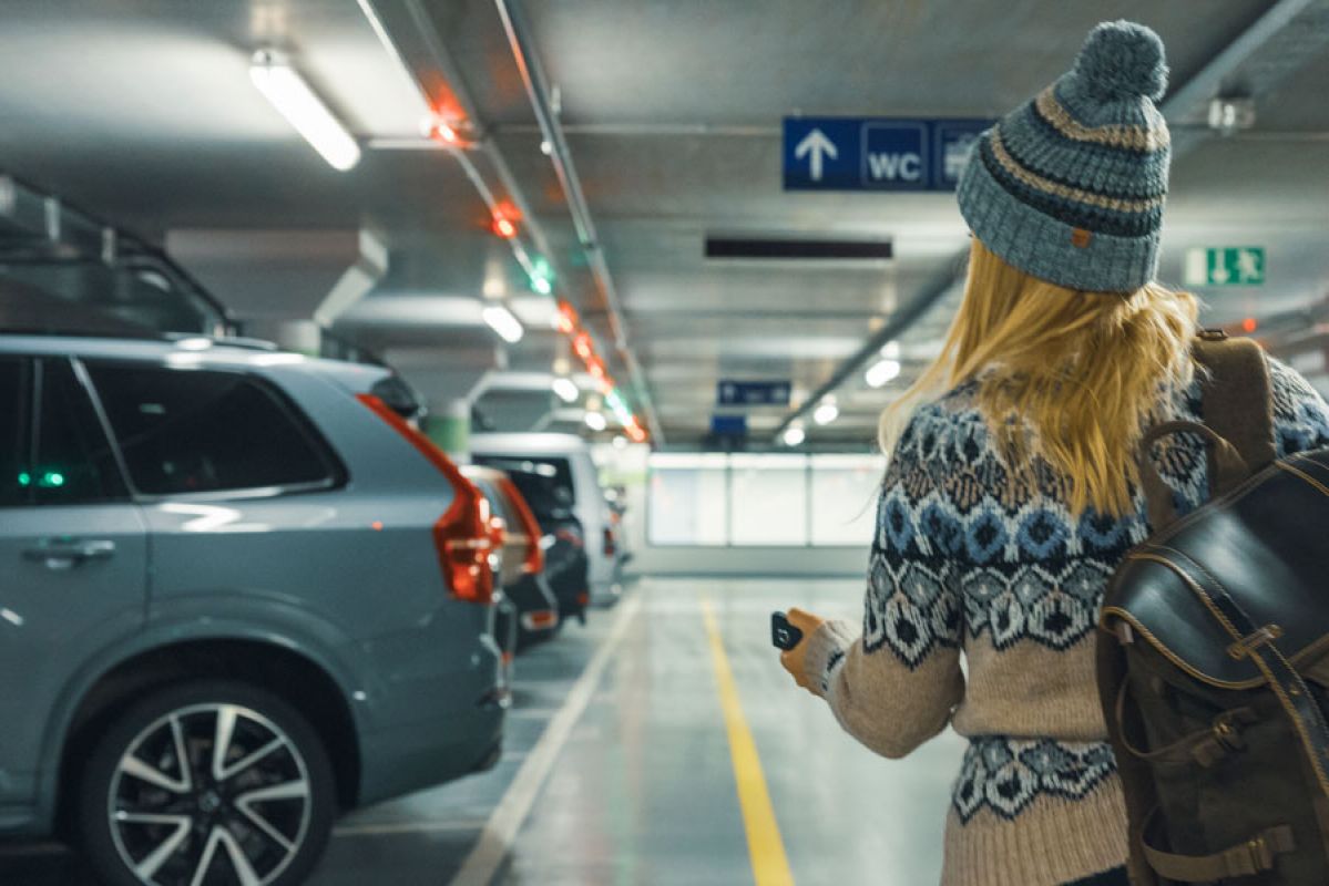 woman walking in underground parking lot