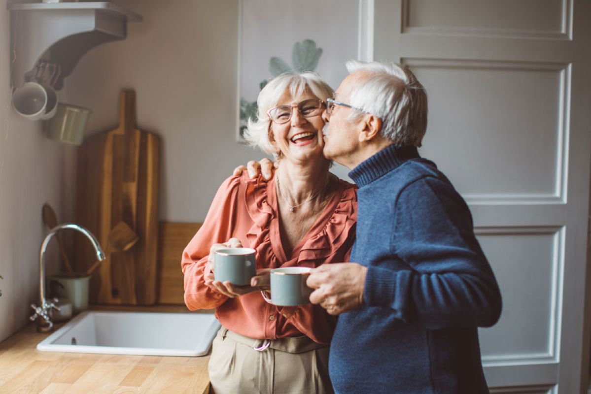 Senior established couple in the kitchen