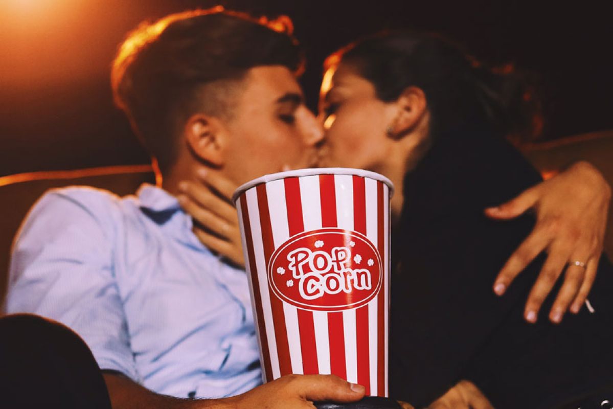 couple kissing at the cinema