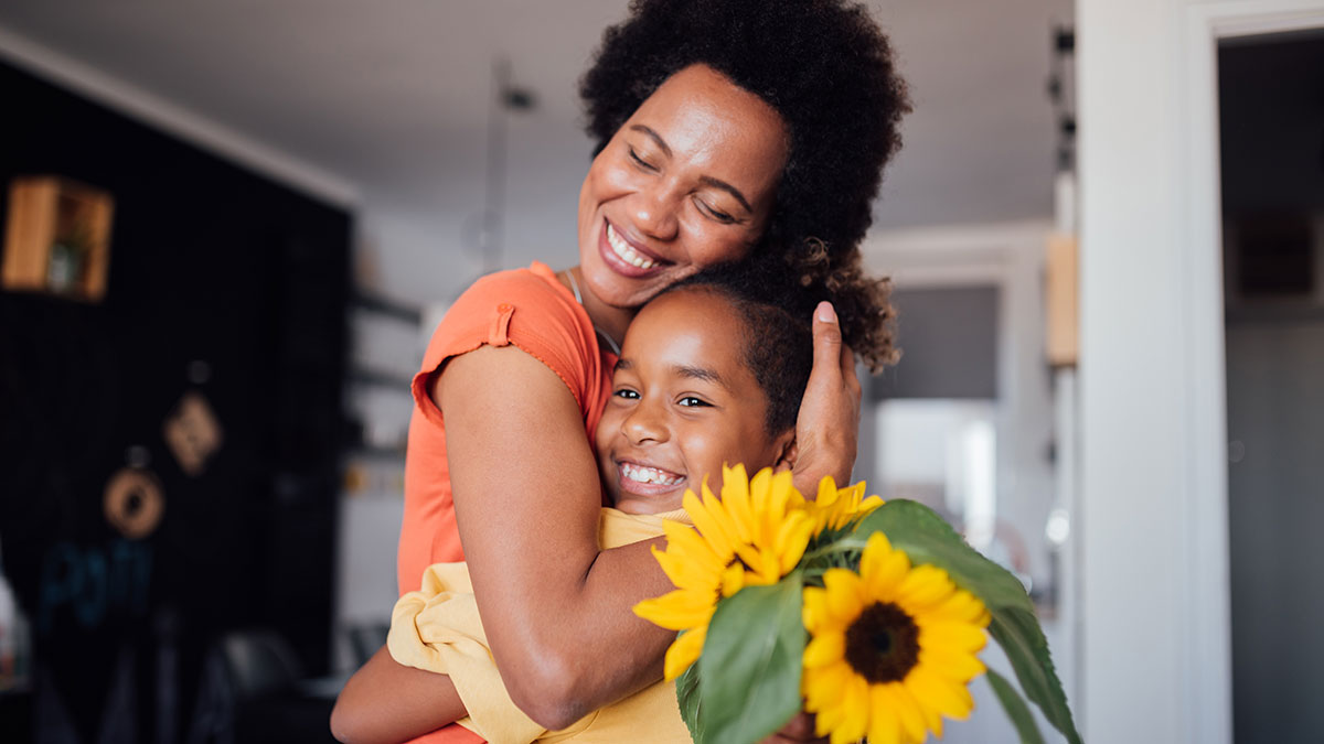 woman child and sunflowers