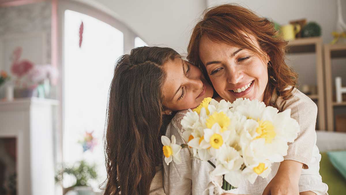 two women with daffodils