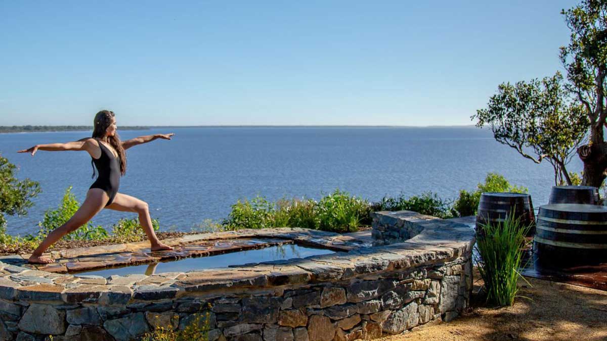 woman doing yoga at hot springs