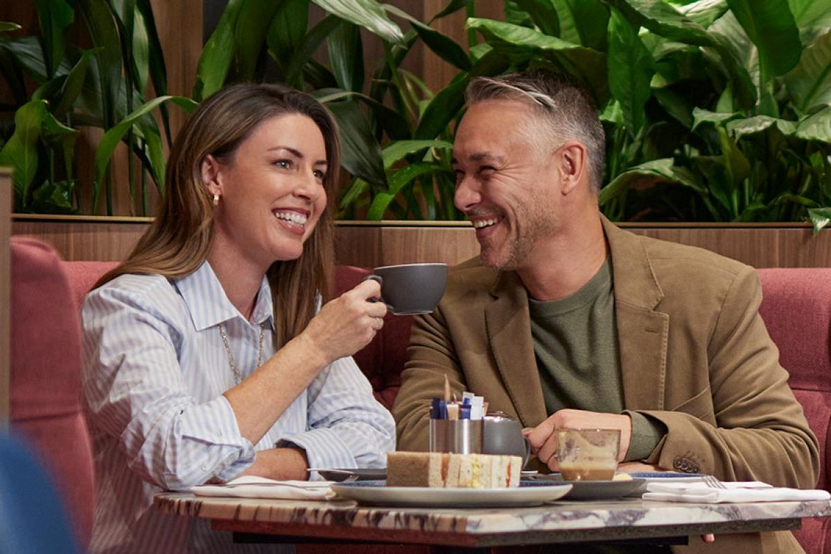 A couple sitting in a coffee lounge