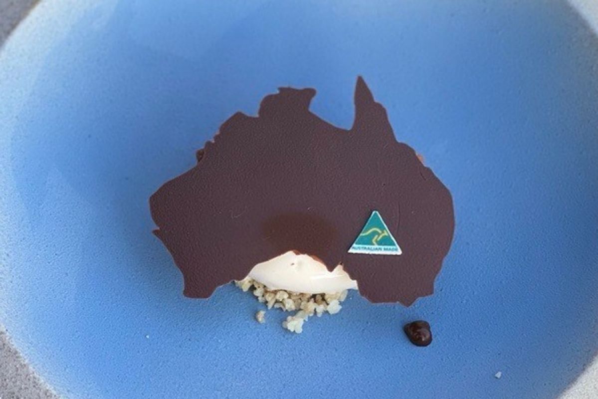 The Land Down Under dessert, topped with a realistic chocolate stencil of Australia and an edible Australian Made logo