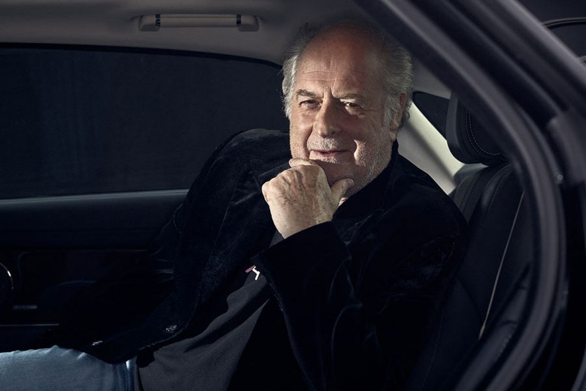 Michael Gudinski sitting inside a car.