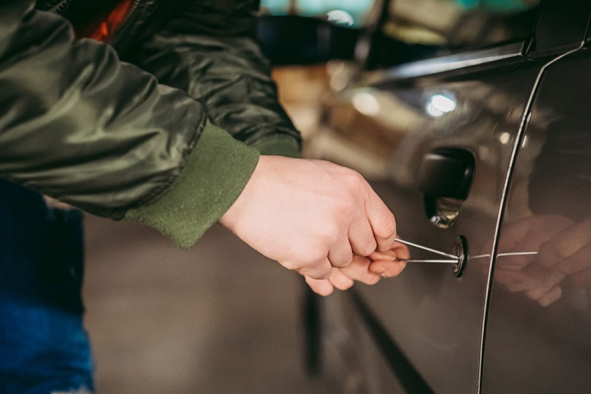 A person breaking into a car