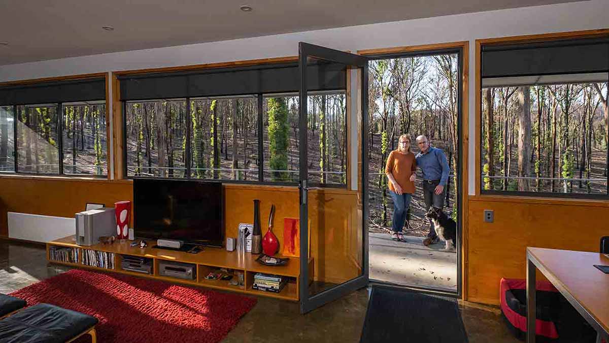 Couple standing in their bushfire resilient home