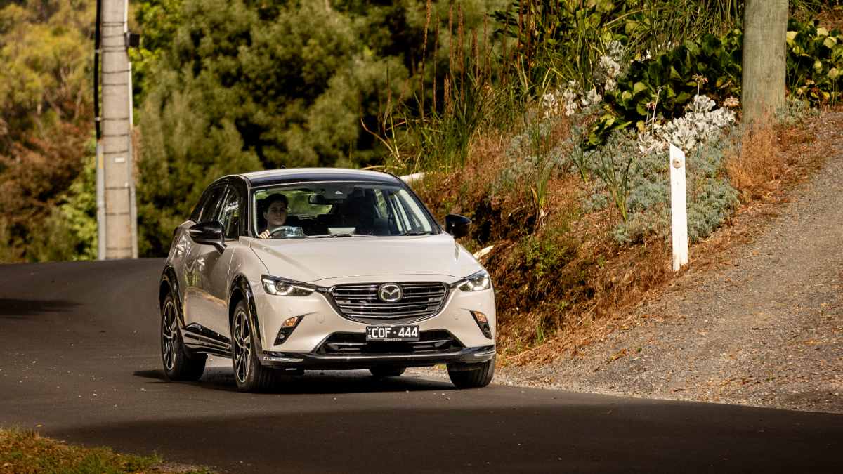 2024 Mazda CX-3 Touring SP driving along a road