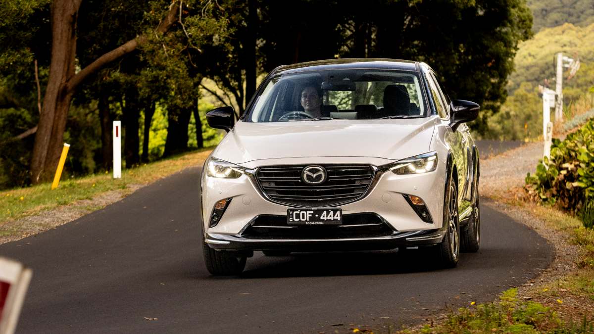 2024 Mazda CX-3 Touring SP close up driving on road