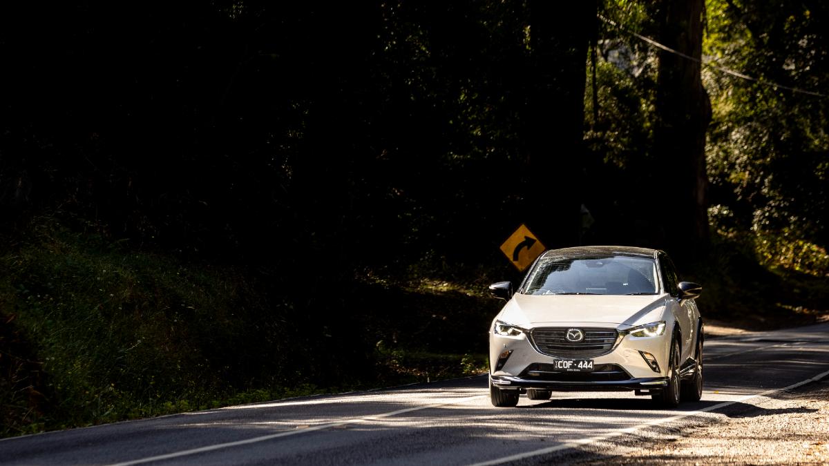 2024 Mazda CX-3 Touring SP driving on road