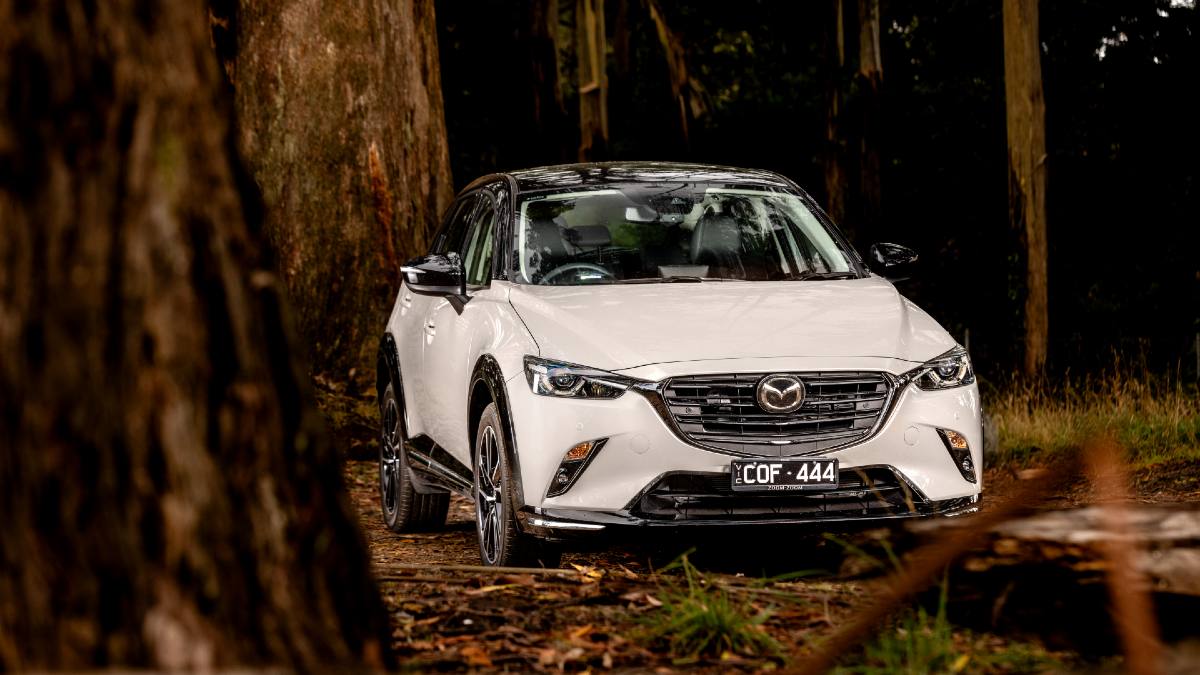 2024 Mazda CX-3 Touring SP exterior parked in woods