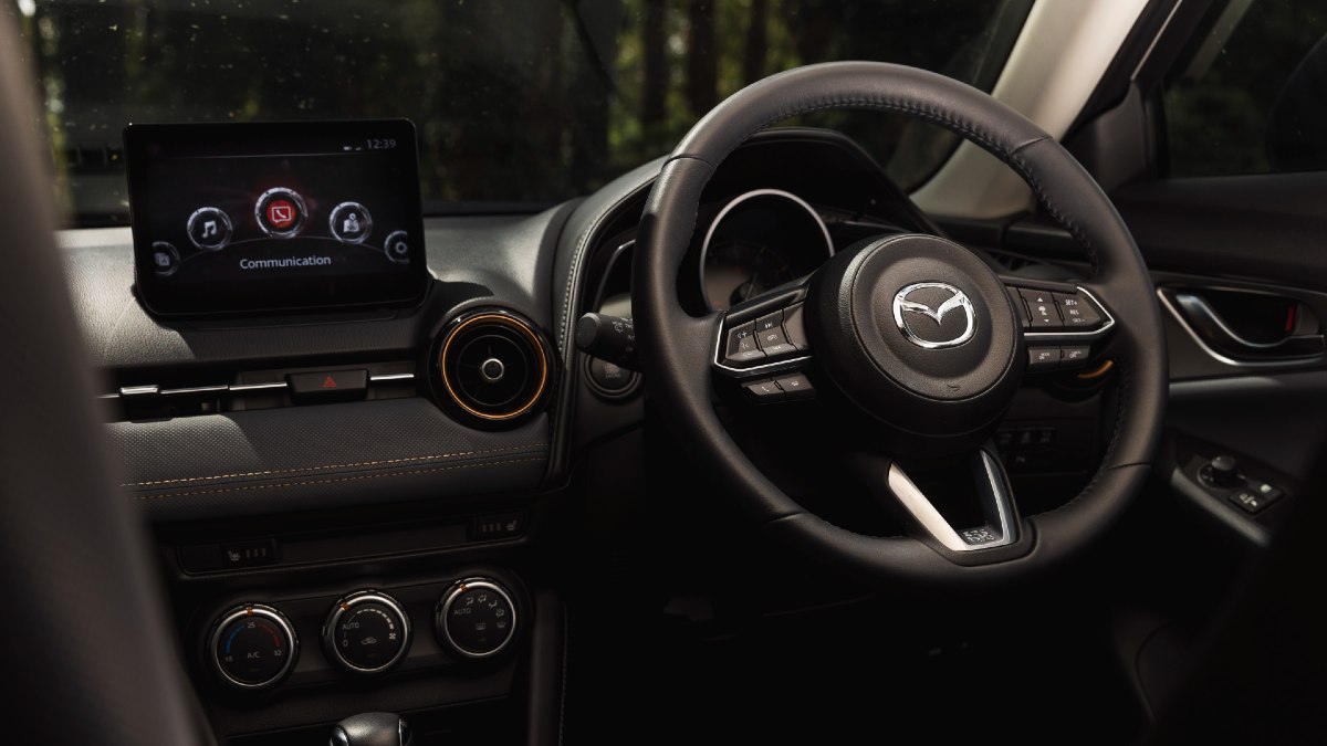 2024 Mazda CX-3 Touring SP close up of steering wheel and infotainment screen