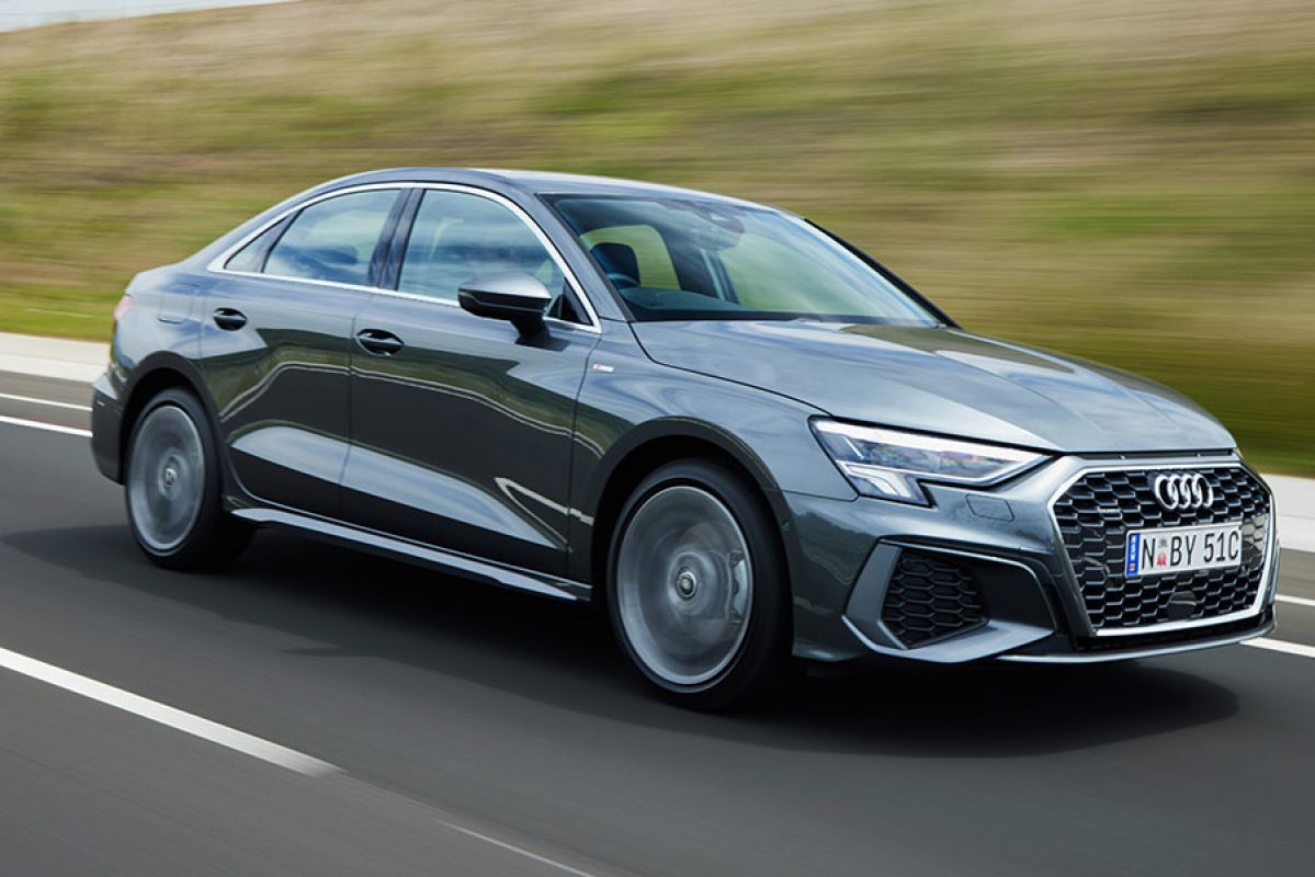 A silver Audi A3 sedan on the road.