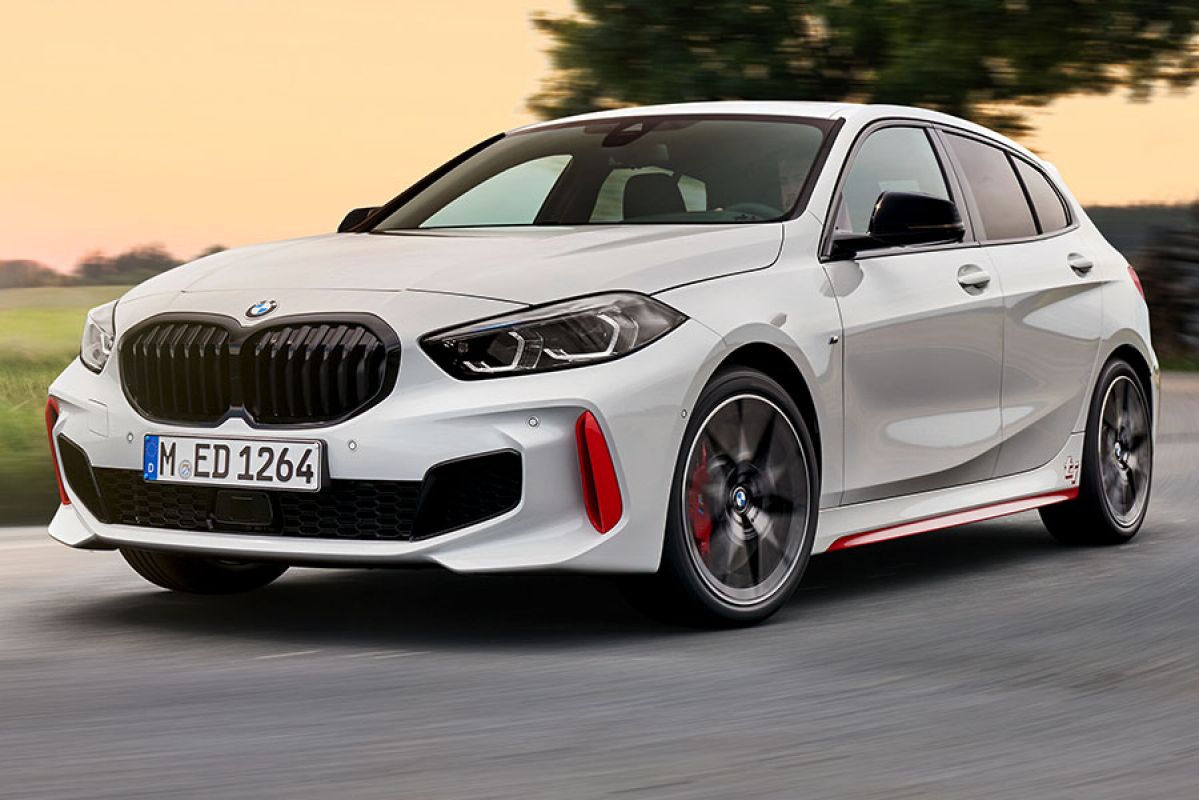 A white BMW 128ti hatch on the track.