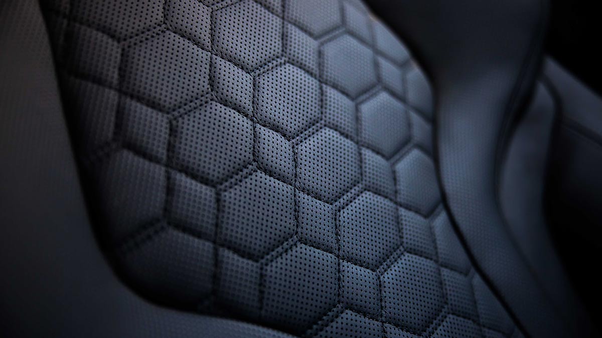 Close up of the stitching on a dark grey seat inside the BMW X3 M Competition 2020