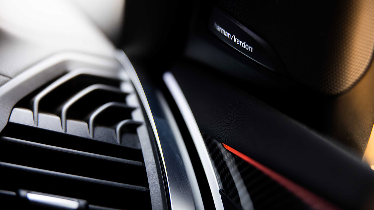 Close up of the air vent and Harman Kardon speaker inside the BMW X3 M Competition 2020