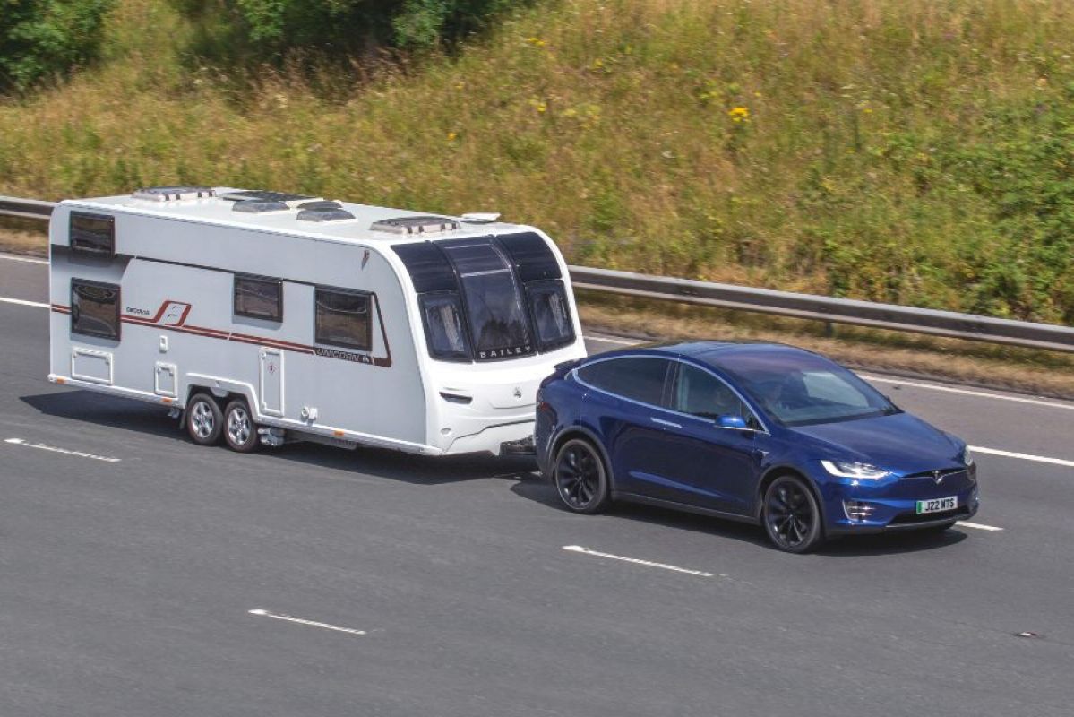 Tesla X towing a caravan