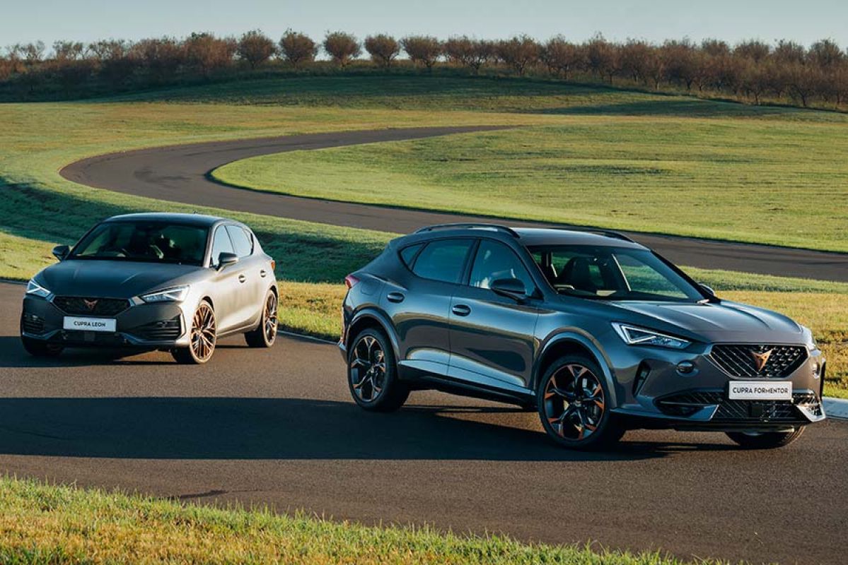 A Cupra Leon and Formentro parked on a track.