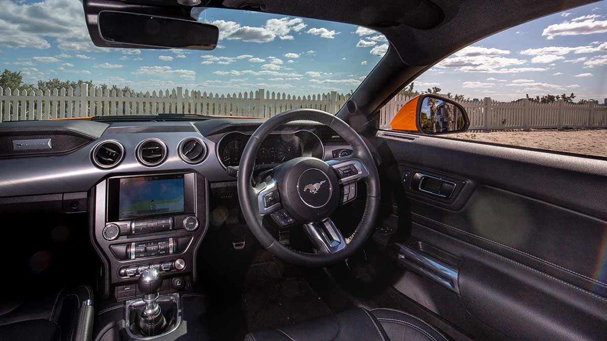 The Ford Mustang's interior features: dash layout and steering wheel