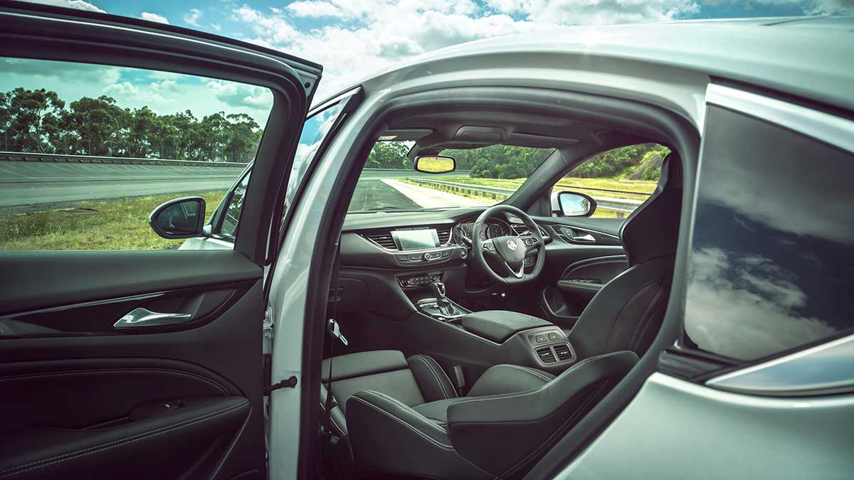 View of the Holden ZB Commodore's interior features from the passenger side: steering wheel and dashboard